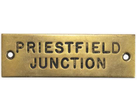 GWR machine engraved brass shelf plate PRIESTFIELD JUNCTION. In very good condition with original black wax infill. Measures 