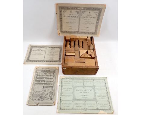 An antique wooden architectural building block toy and instructions 