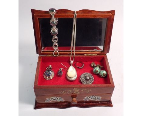 A mother of pearl inlaid jewellery box and contents of silver jewellery plus pair of Chinese enamel bead earrings 