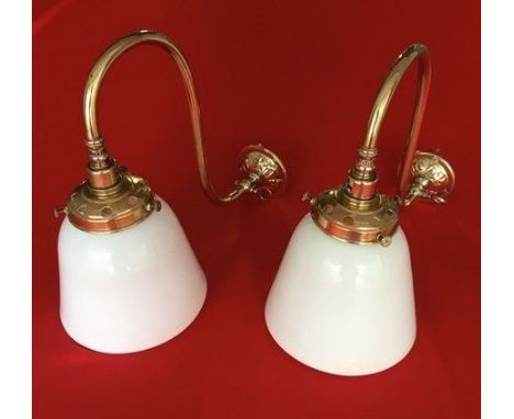 A pair of 19th century brass gas wall lights and two glass shades plus globe shade and a pair of brass ships swivel pendant l