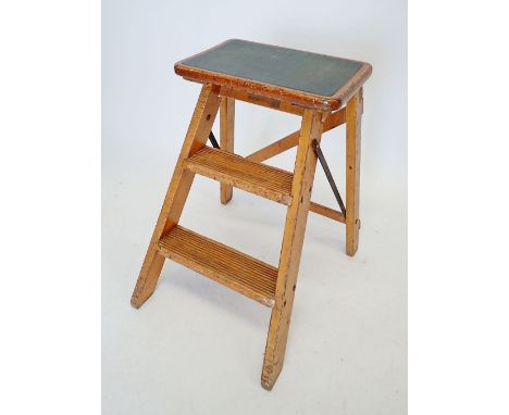 A vintage folding step stool and a small four legged stool 
