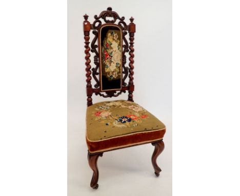 A Victorian side chair with carved scrollwork and spiral back with original tapestry seat and back panel, all on cabriole sup