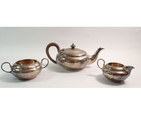 A silver three piece tea service, London 1916 by C W Fletcher, total weight 860g