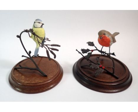 A Coalport Robin and Blue Tit perched on bronze finish branches and wooden stands, Blue Tit 14cm