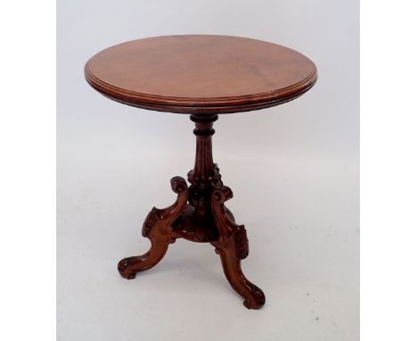 A Victorian mahogany tripod table with ornate scroll base, 56cm