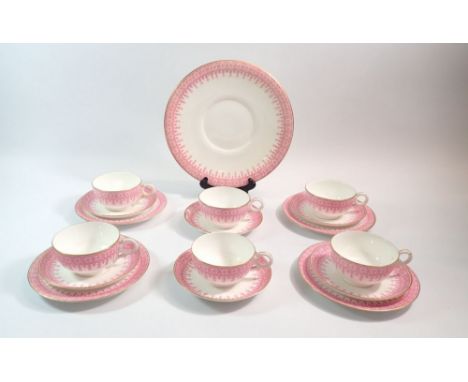 An Edwardian Royal Worcester tea service with pink border decoration pattern W1970 comprising six cups and saucers, four tea 