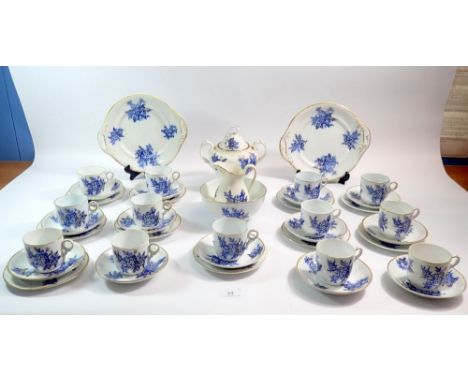 A Victorian blue floral tea service with thirteen cups and saucers, ten side plates, two covered sugar, jug, bowl and cake pl