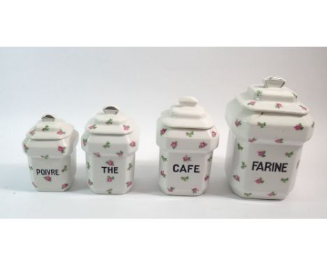 A French vintage set of four kitchen storage jars with sprigged rose decoration, tallest 21cm