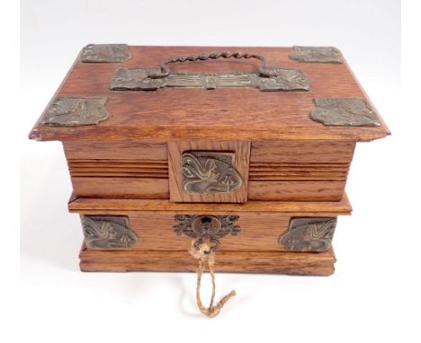 An Edwardian small oak jewellery or trinket box with applied brass mounts embossed Art Nouveau stylised women's heads, comple
