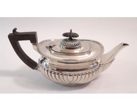 A silver half gadrooned teapot, Birmingham 1910, 348g