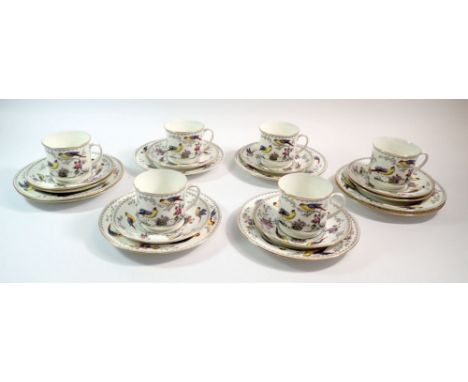 A Salon China Burma tea service decorated exotic birds comprising six cups, eight saucers and eight cake plates