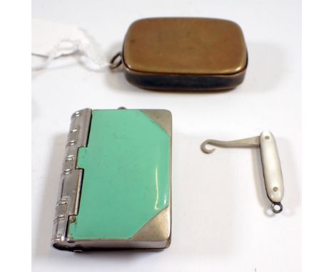 A brass vesta case and a book form vesta and stamp case plus a miniature folding mother of pearl button hook 