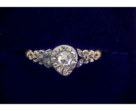 An antique old cut diamond ring set in yellow and white metal, unmarked, repaired in places to shank, size K-L, 3g