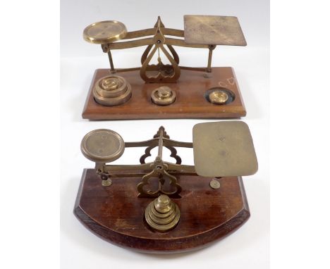 Two sets of brass postal scales 
