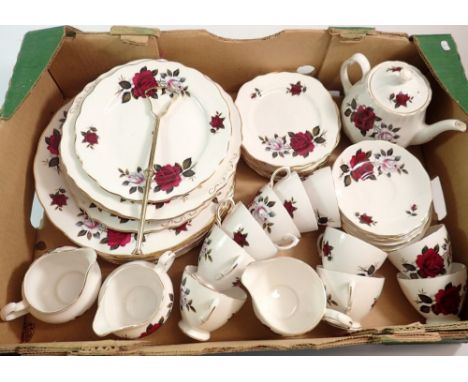 A Coclough vintage tea and dinner service comprising eight dinner plates, ten cups and saucers, cake plate, teapot, two jugs,