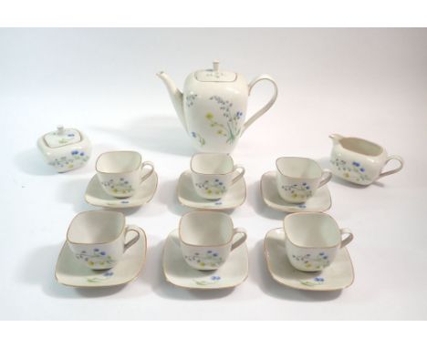 A German porcelain vintage coffee set decorated sprays of blue flowers comprising coffee pot, sugar, milk and six cups and sa