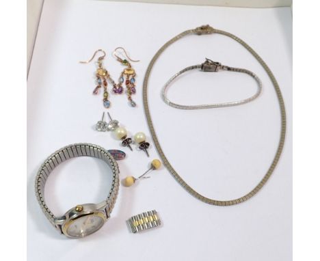 A Timex ladies watch with mother of pearl face, silver bracelet and necklace and yellow metal earrings etc.