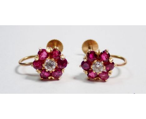 A fine pair of diamond and ruby cluster earrings with screw fittings, 10 x 8mm