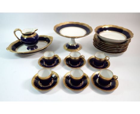 A Limoges late 19th century porcelain blue and gilt edged coffee set by C Ahrenfeldt comprising six demitasse cups and saucer