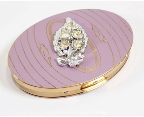 A Fifth Avenue enamel and paste oval compact, 9 x 6cm