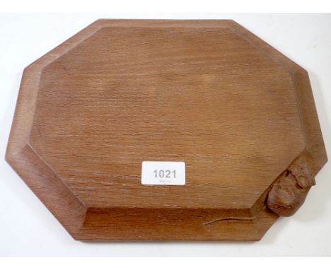 A Robert Thompson Mouseman Arts &amp; Crafts oak bread board with carved mouse to side, 31 x 25cm