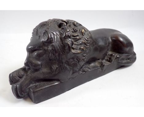A bronze sleeping lion, 20cm long