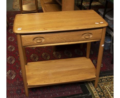 An Ercol set of furniture comprising: single drawer side table; two tier coffee table; small drop leaf table and two two-tier