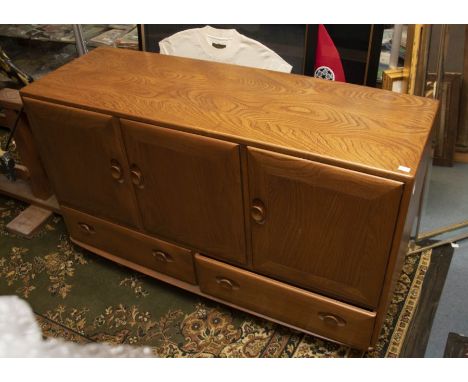 An Ercol sideboard - one double, one single cupboard over two drawers&nbsp;
