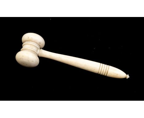 An early 20th Century turned ivory gavel, approx 15cm; together with&nbsp;An Asian carved ivory figure of the Goddess either 