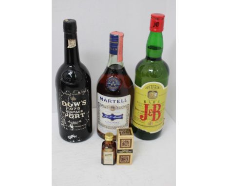 A collection of spirits to include; Martell Blue Label Cognac, Dows 1975 Port, J&B Whisky, Extra Dry Cointreau miniature, Coi
