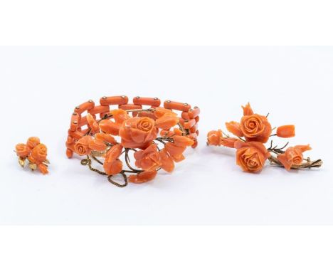 A Victorian coral bracelet, the oval openwork panel applied with carved flowers and foliage, on a coral gate-link bracelet; t