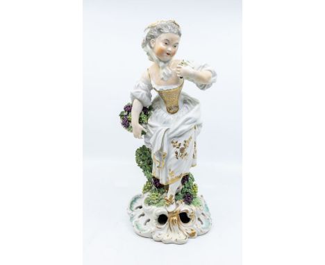 A 19th Century Derby figure emblematic of Autumn from The French Seasons after the Tournai model by N JF Gauron, the lady hol
