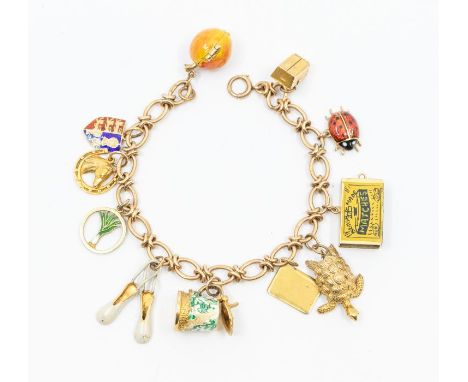 A 9ct gold charm bracelet with various charms including enamel apple opening to reveal Adam & Eve, Queen of hearts playing ca