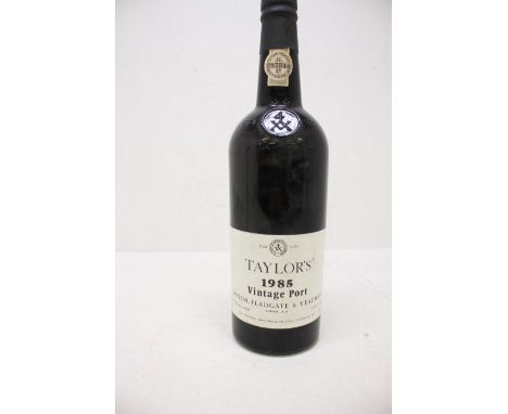 A Bottle Of Taylors 1985 Vintage Port Bottle Is In Good Overall Condition With Slightly Sprung Cap 