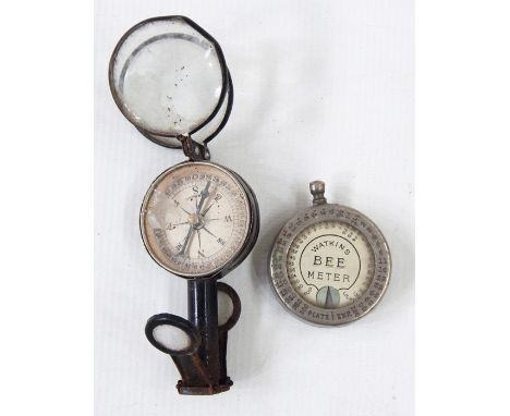 Watkins 'Bee Meter' light meter, and a small compass with folding supports
