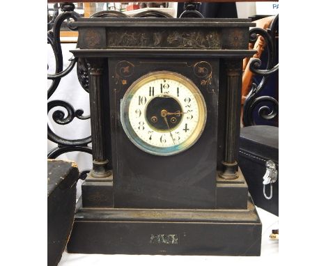 Two black slate mantel clocks, one with Roman numerals to the white enamel dial, the other of classical form with figures and