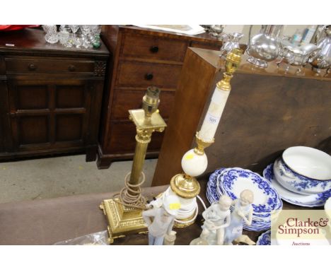 An onyx and gilt table lamp base; and a brass Corinthian column similar 