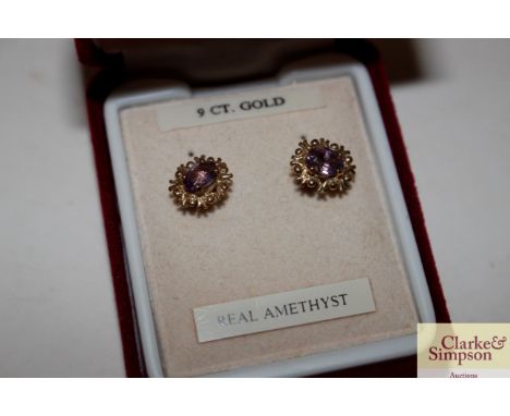 A pair of 9ct gold and amethyst set ear-rings 