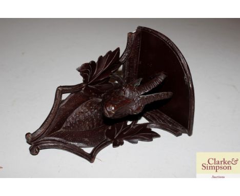 A small Black Forest style wall bracket