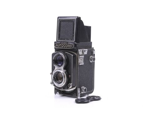 A Minolta Autocord 6x6 medium format TLR camera. Serial No. 427327. With a Minolta 75mm f3.5 Rokkor taking lens, lens caps, E