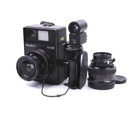 A Polaroid 600 SE instant rangefinder press camera outfit. With two lenses; a Mamiya 75mm f5.6 lens and a Mamiya 127mm f4.7 l