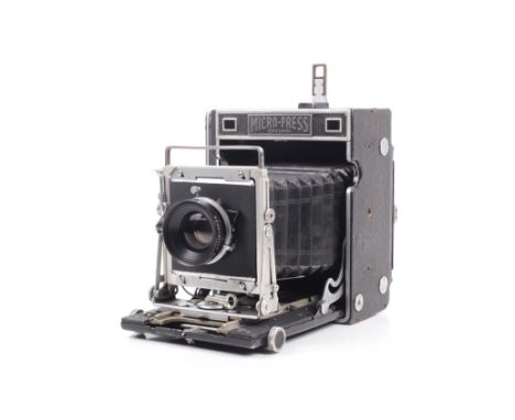 An M.P.P. Micro Press England 4x5 large format camera. With focusing screen and two lenses; a Schneider-Kreuznach 135mm f4.7 