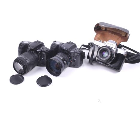 Three Minolta 35mm SLR cameras. To include a SRT100X with an MD Rokkor 50mm f2 lens and ERC, a Dynax 500si Super with a 28-80