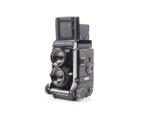 A Mamiya C330 6x6 medium format TLR camera. Serial No. D52949. With an 80mm f2.8 Mamiya-Sekor taking lens and instruction man