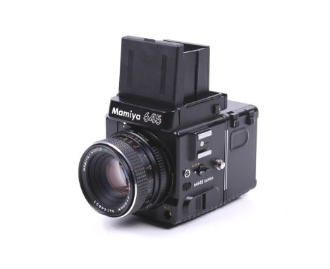 A Mamiya m645 Super 6x4.5 medium format SLR camera. With a Mamiya Sekor C 80mm f2.8 lens, 120 film back, 2 film back cases, d