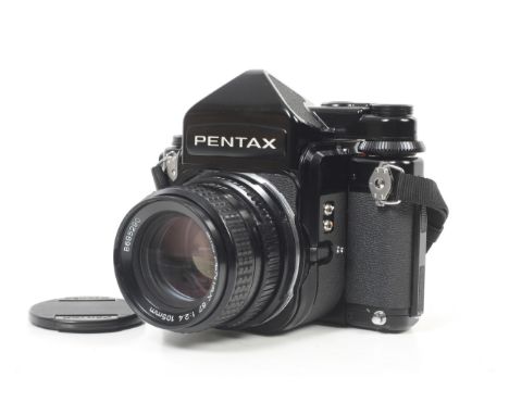 A late Pentax 67 6x7 medium format SLR camera. Serial No. 4200591. With an SMC Pentax 105mm f2.4 lens, all caps, prism finder