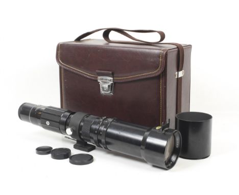 A Tele-Tokina 600mm f8 sectional telephoto lens. Serial No. 8200268. Olympus OM mount. With tripod mount ring, hood and Tokin