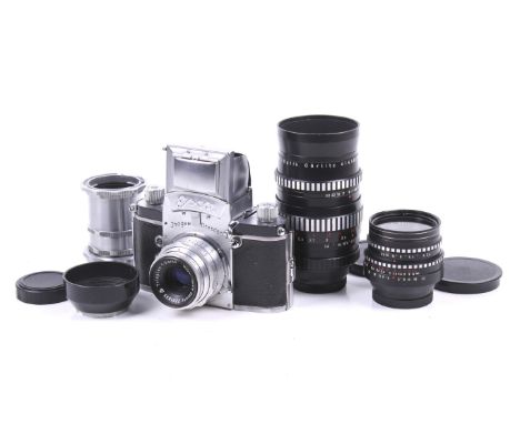 An Ihagee Dresden Exa 35mm SLR camera outfit. With three Meyer-Optik Gorlitz lenses; a 30mm f3.5 Lydith, a 50mm f2.9 Trioplan