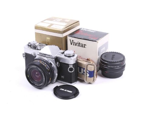 An Olympus OM-1N 35mm SLR camera. Chrome. Serial No. 1708430. With a Sunactinon 28mm f2.8 Auto MC lens, Vivitar 2x Tele Conve