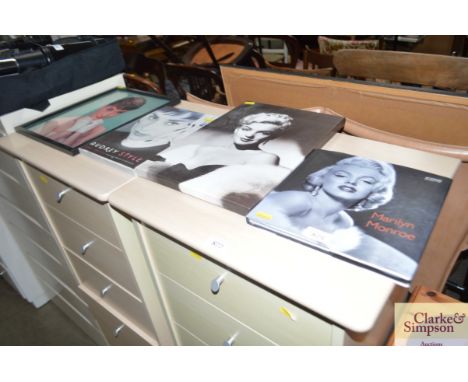 A Marilyn Munro print; a Marilyn Munro book and a Audrey Hepburn print and book